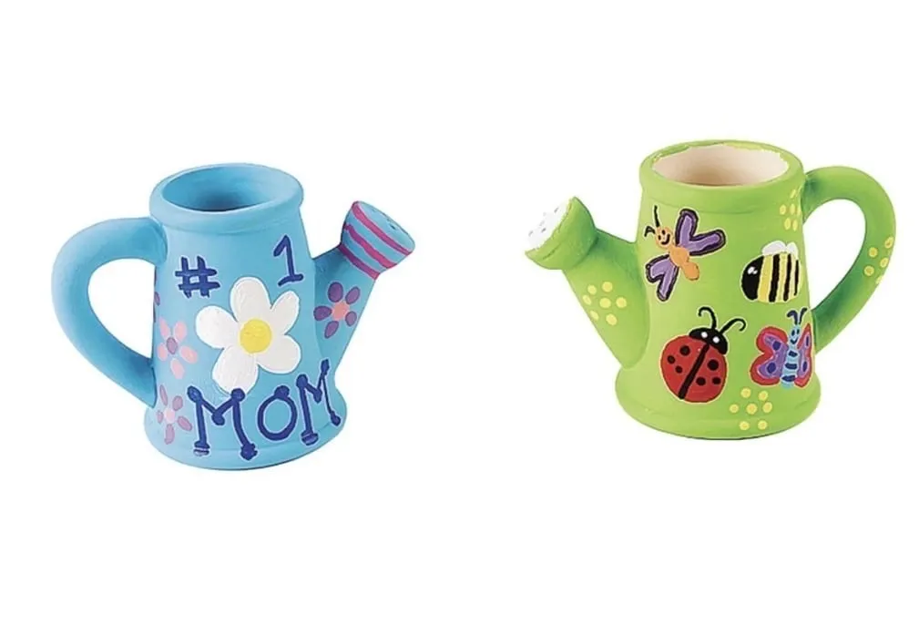 Two hand-painted watering cans decorated with flowers and ladybugs.