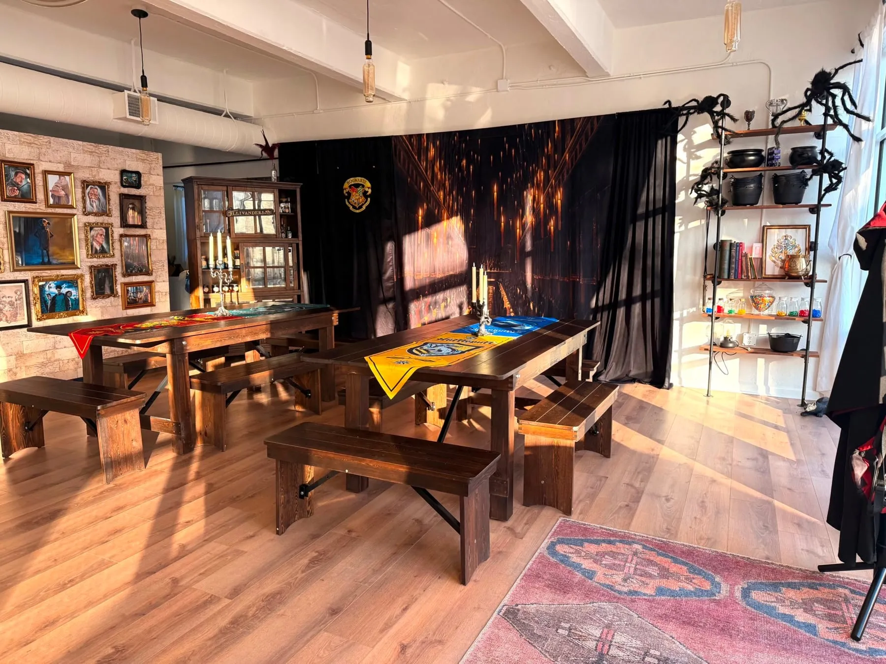Long wooden tables and benches in the Wand & Willow studio.