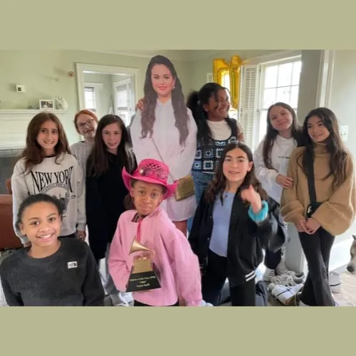 A group of girls at a birthday party in the studio.